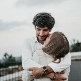 A man and woman embracing in a huge.